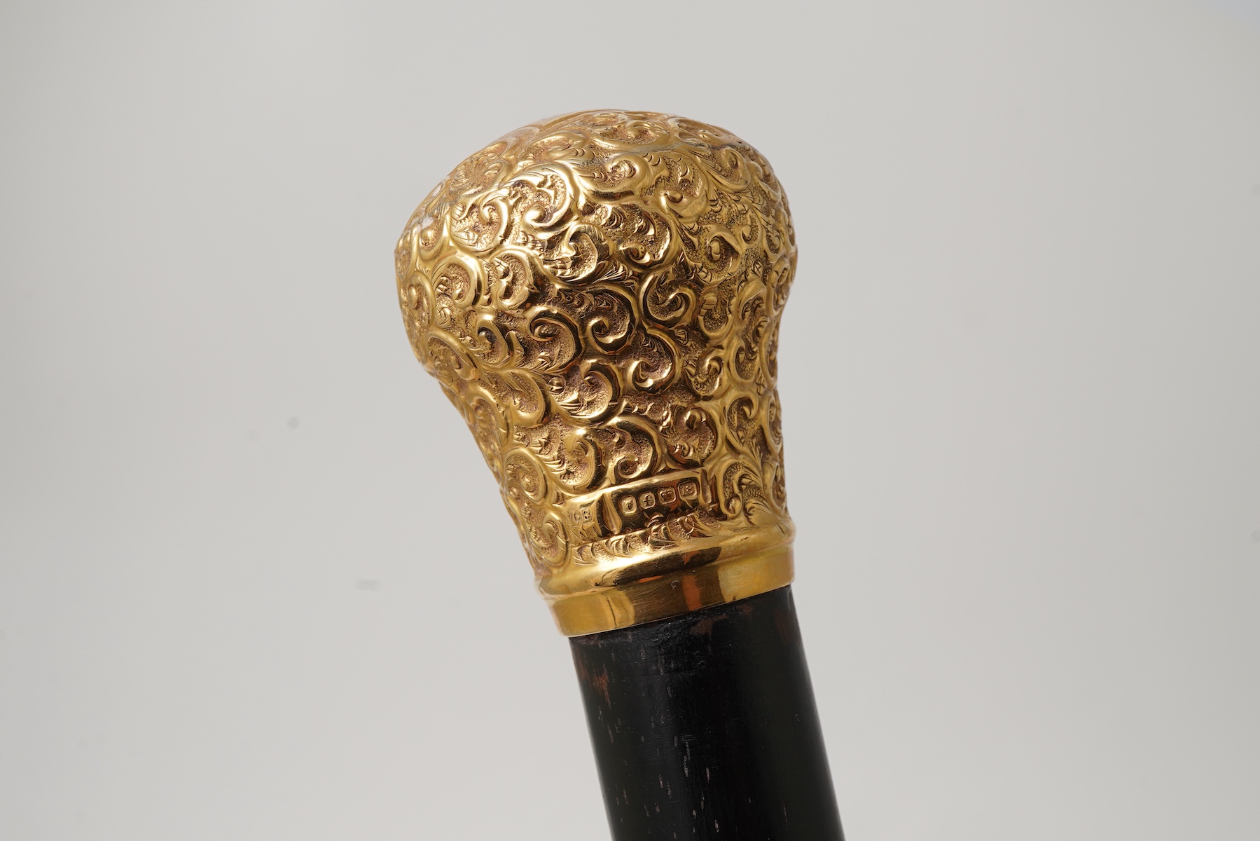 An 18ct gold-mounted walking stick, circa 1901